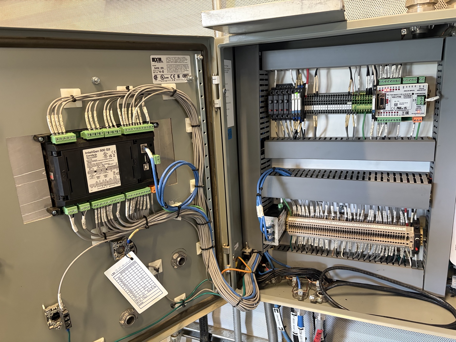 Open generator control enclosure with ComAp controller and wiring